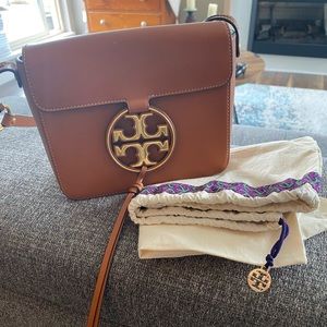 Tory Burch monogram tassel crossbody bag. Duster bag included.